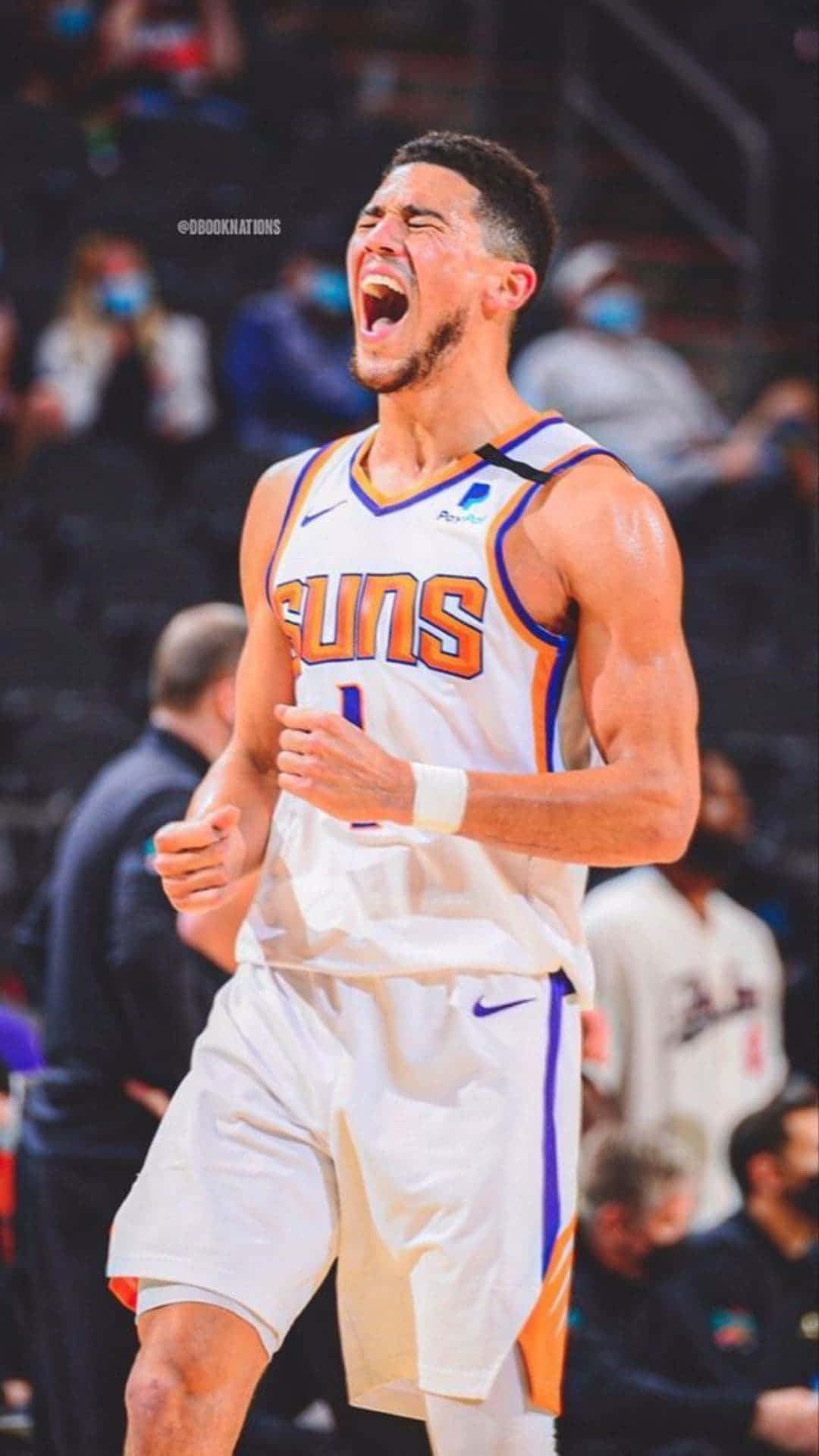 1. Nba Star Devin Booker Making A Shot With His Iphone Background