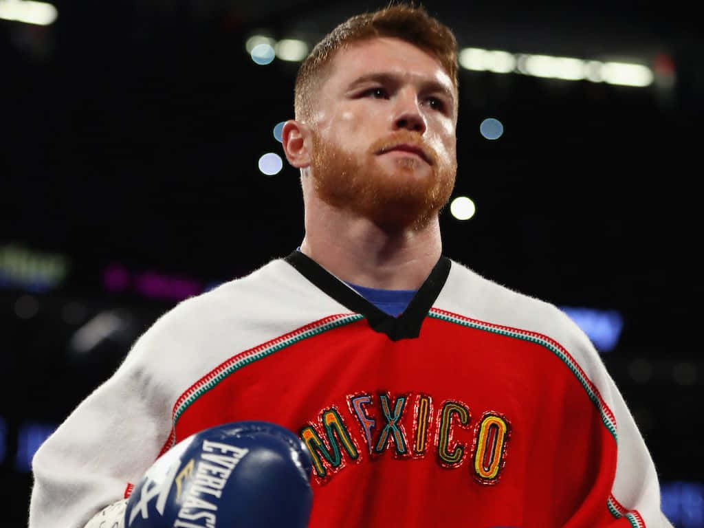 1. Professional Boxer Canelo Alvarez In A Victory Pose Background