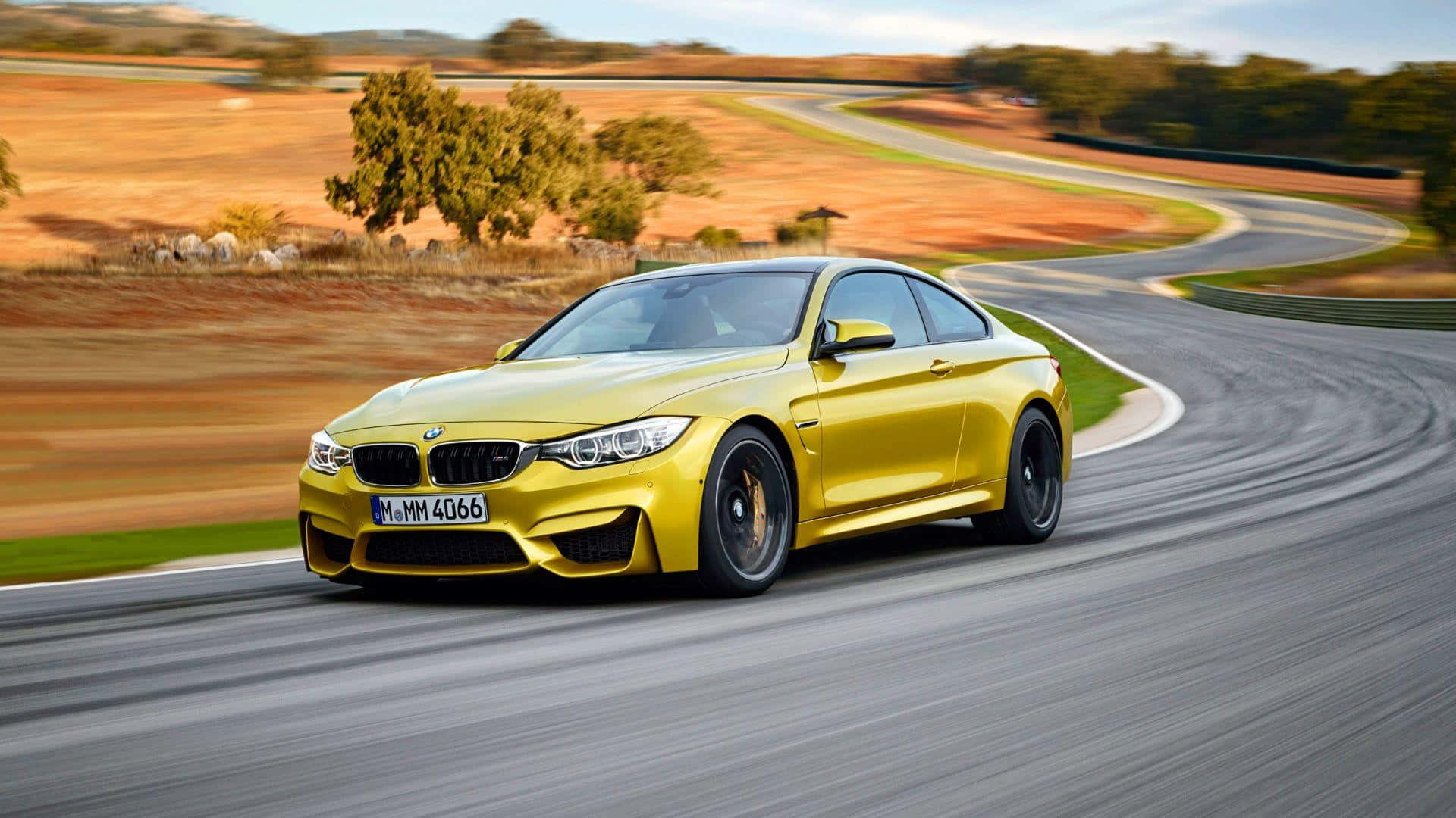 1920x1080 Bmw Golden M4 Curved Road Background