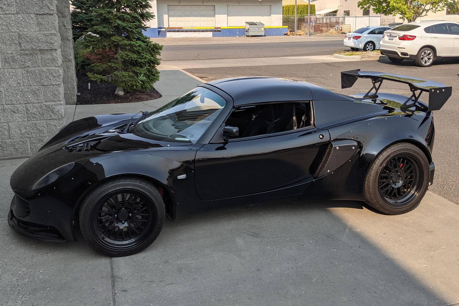 2006 Shiny Black Lotus Exige Car Background