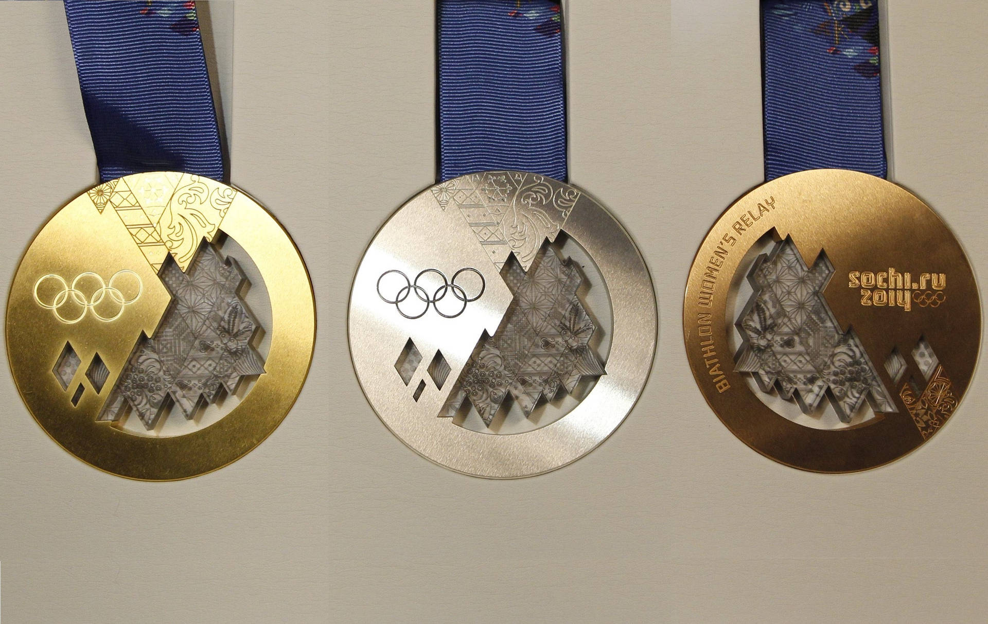 3 Golden Medals For A Trio Of Olympic Champions Background