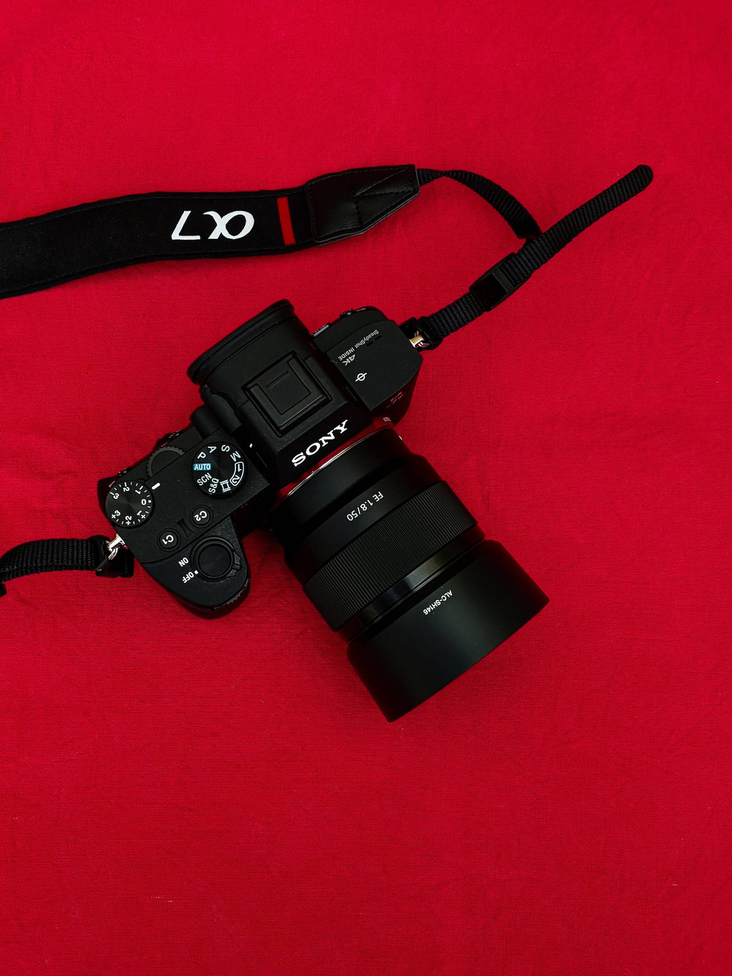4k Black Camera On Red Surface