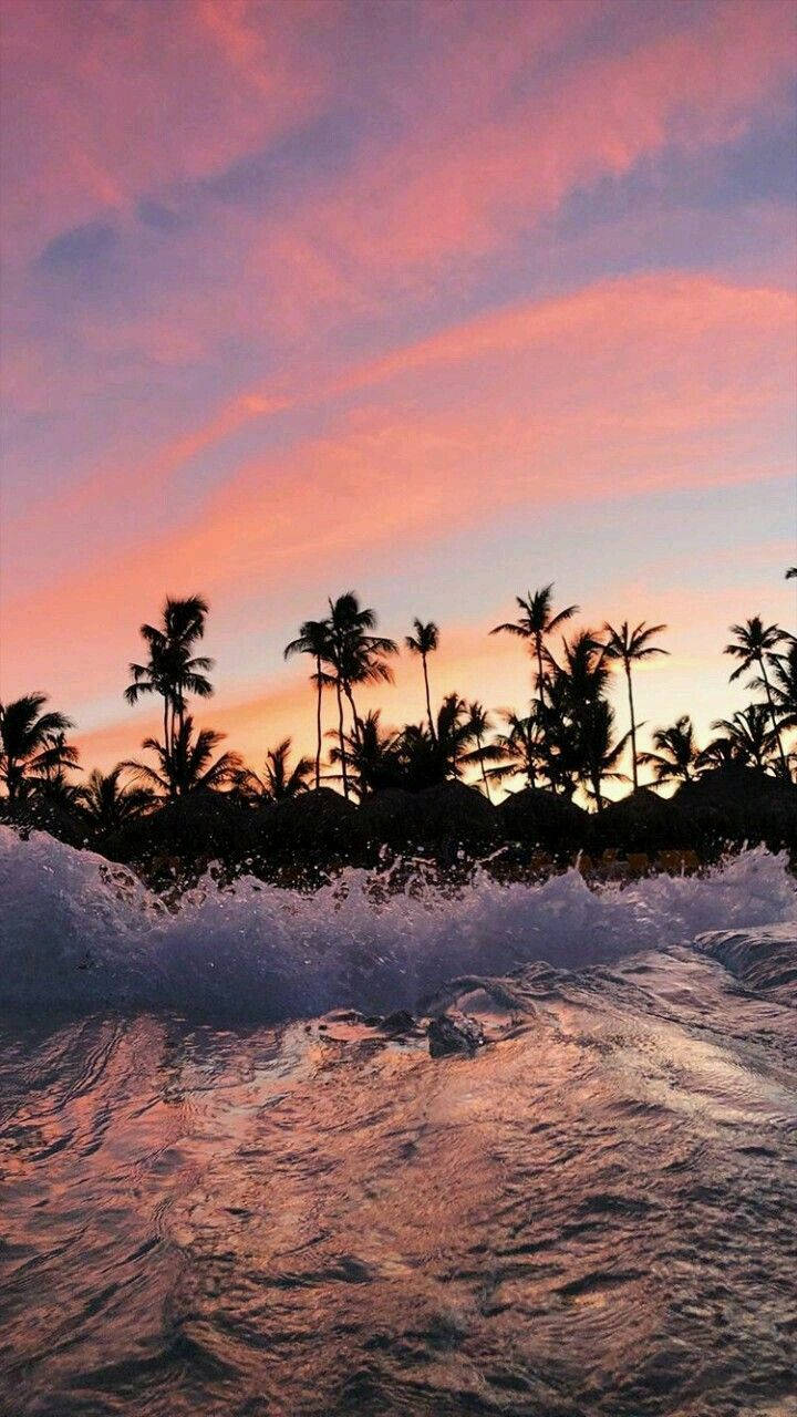 4k Iphone Beach Waves Crashing Under Sunset Background