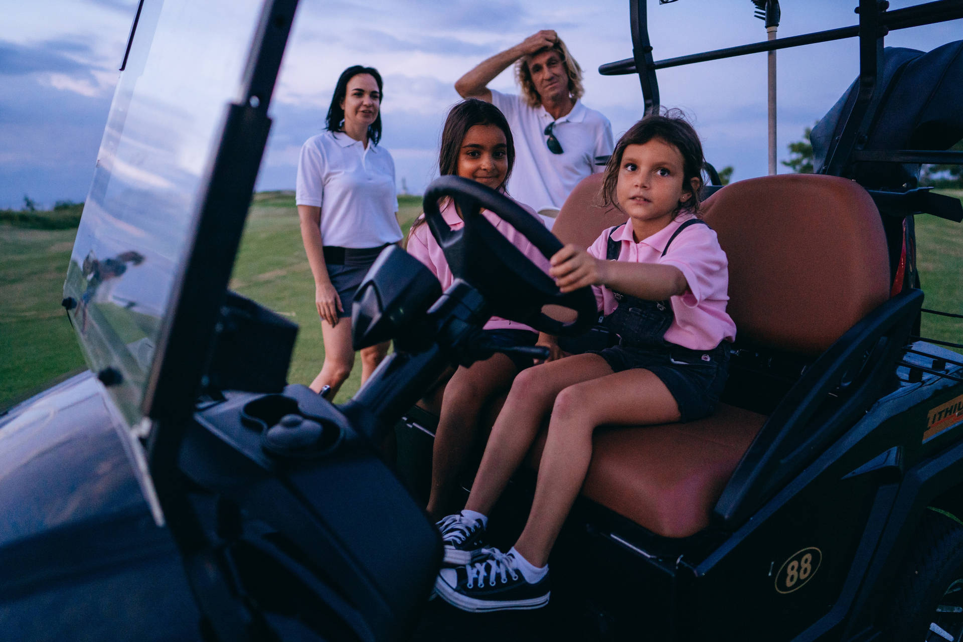 4k Kid Sitting On Golf Cart Background