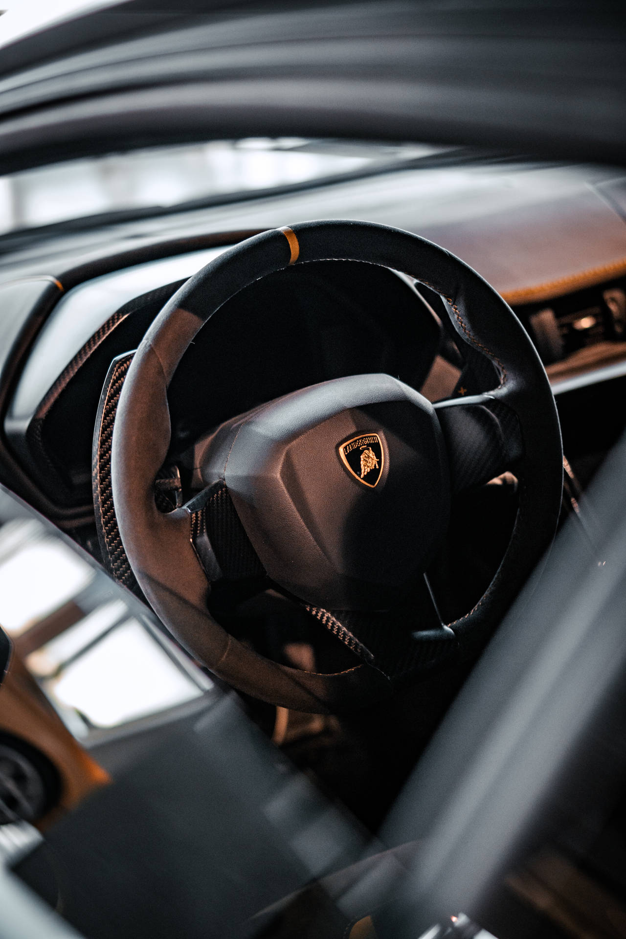 4k Lamborghini Logo On Steering Wheel Background