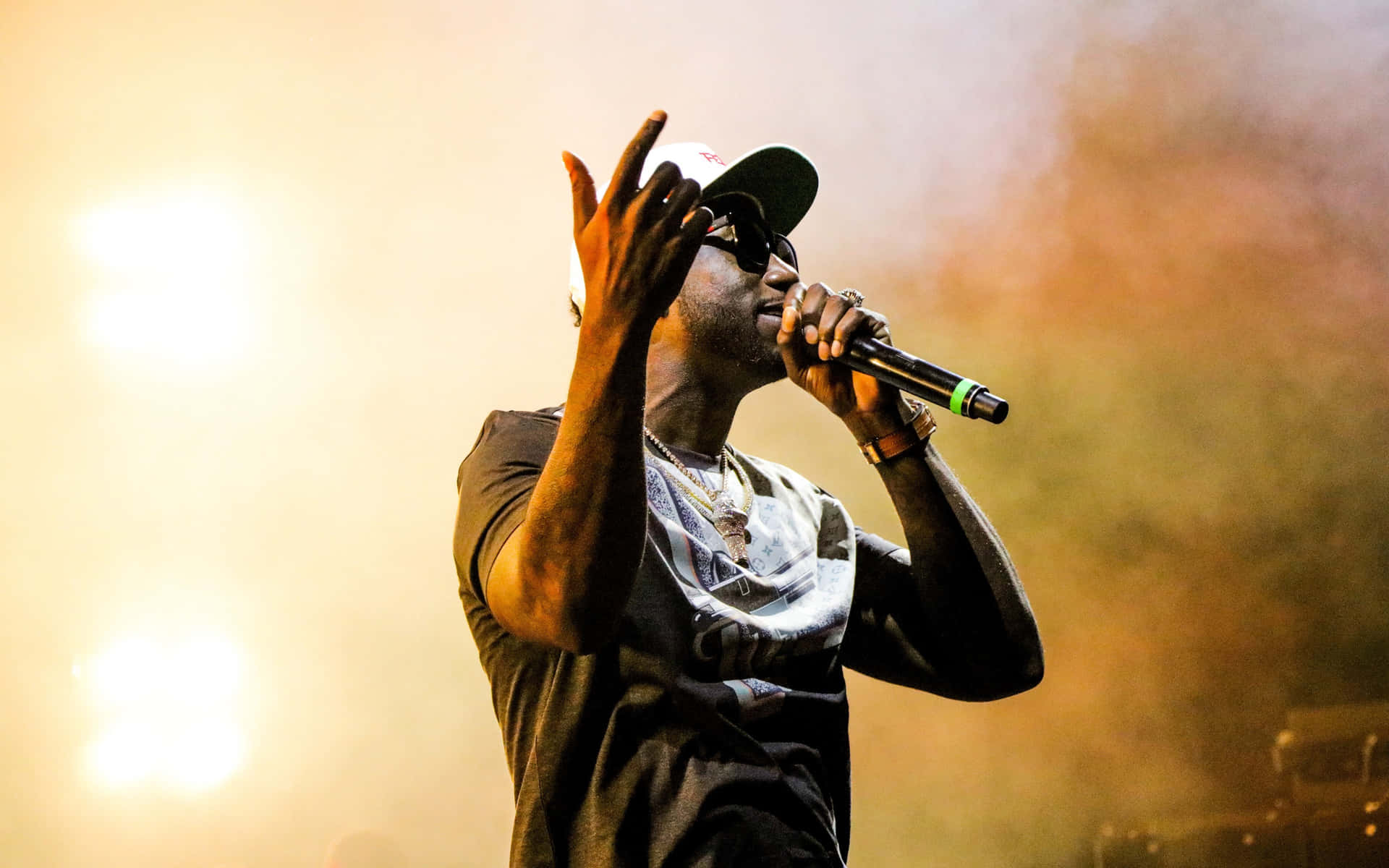 4k Rapper Performing At A Glow In The Dark Concert Background