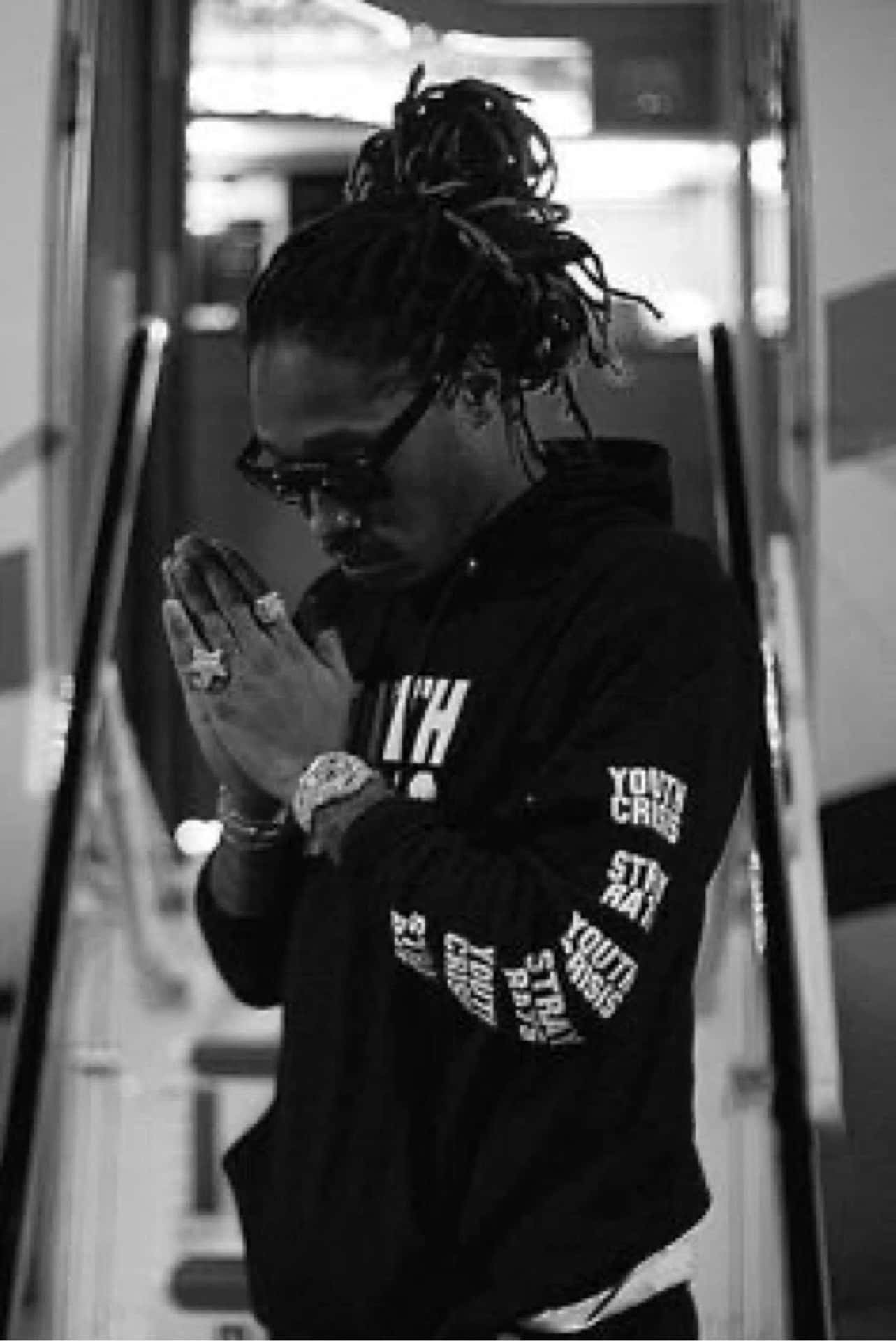 4k Rapper Posing In Vibrant Streetwear Background