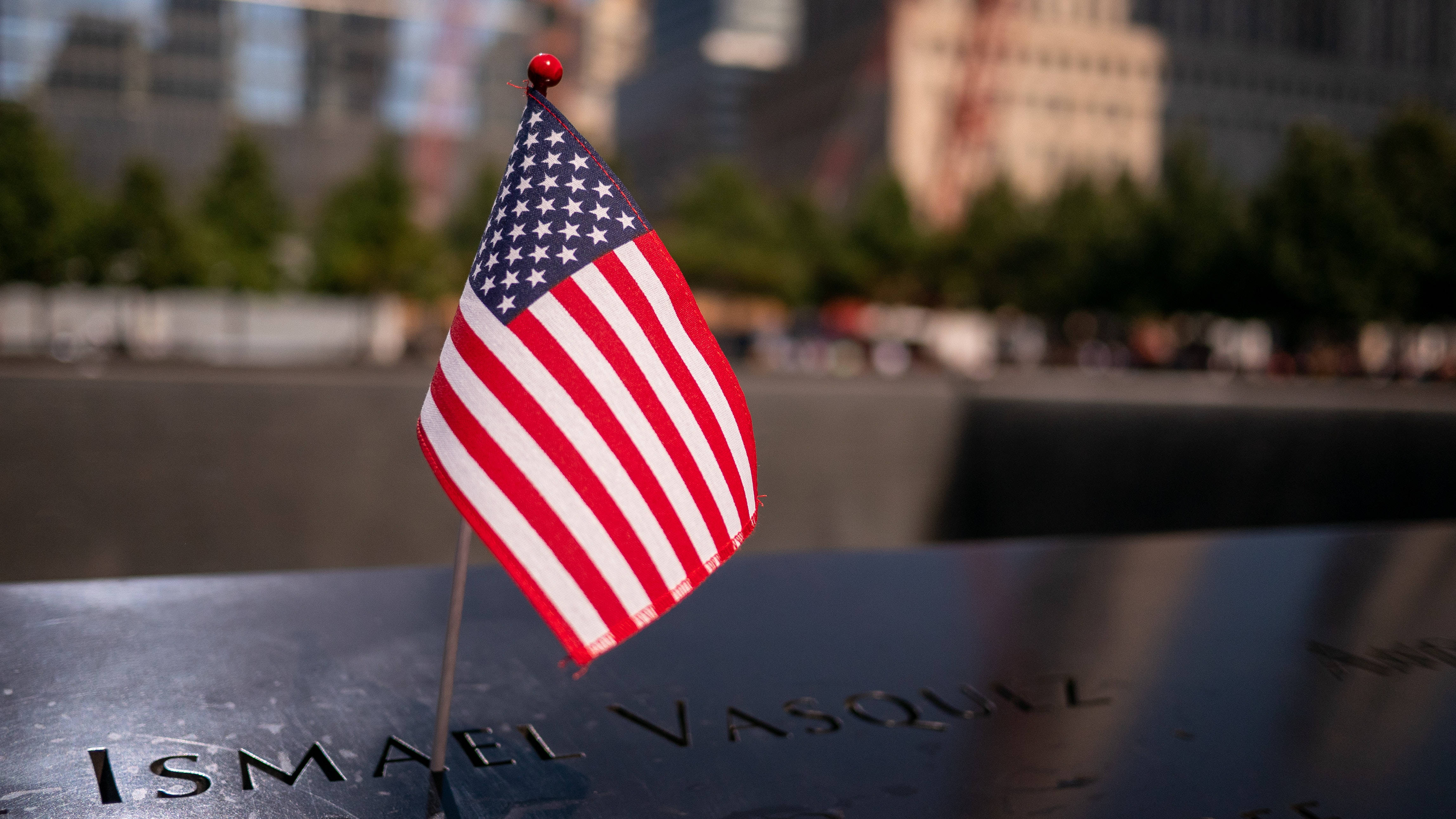 911 Memorial Standing American Flag Background