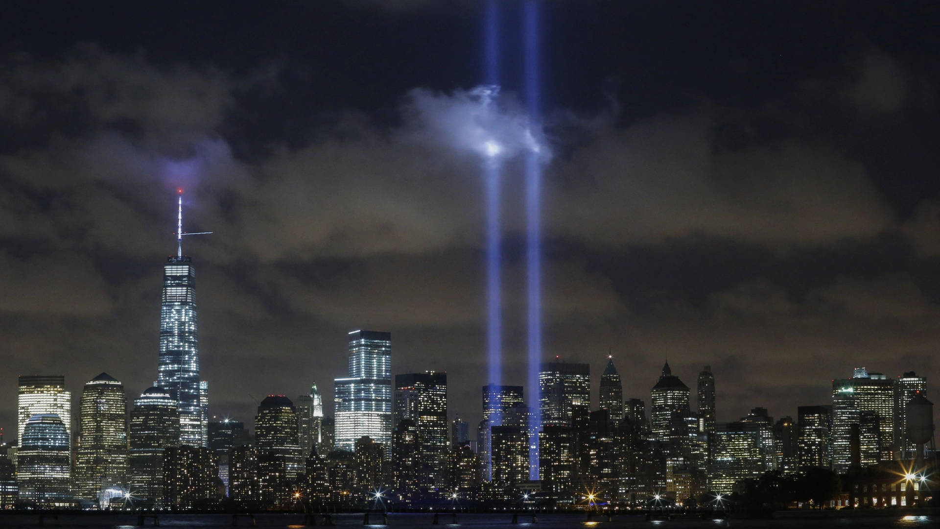 911 Memorial Tribute In Cloudy Sky Background