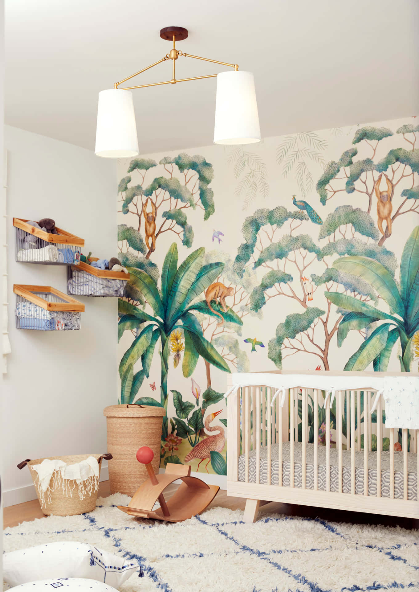 A Baby's Room With A Jungle Mural Background