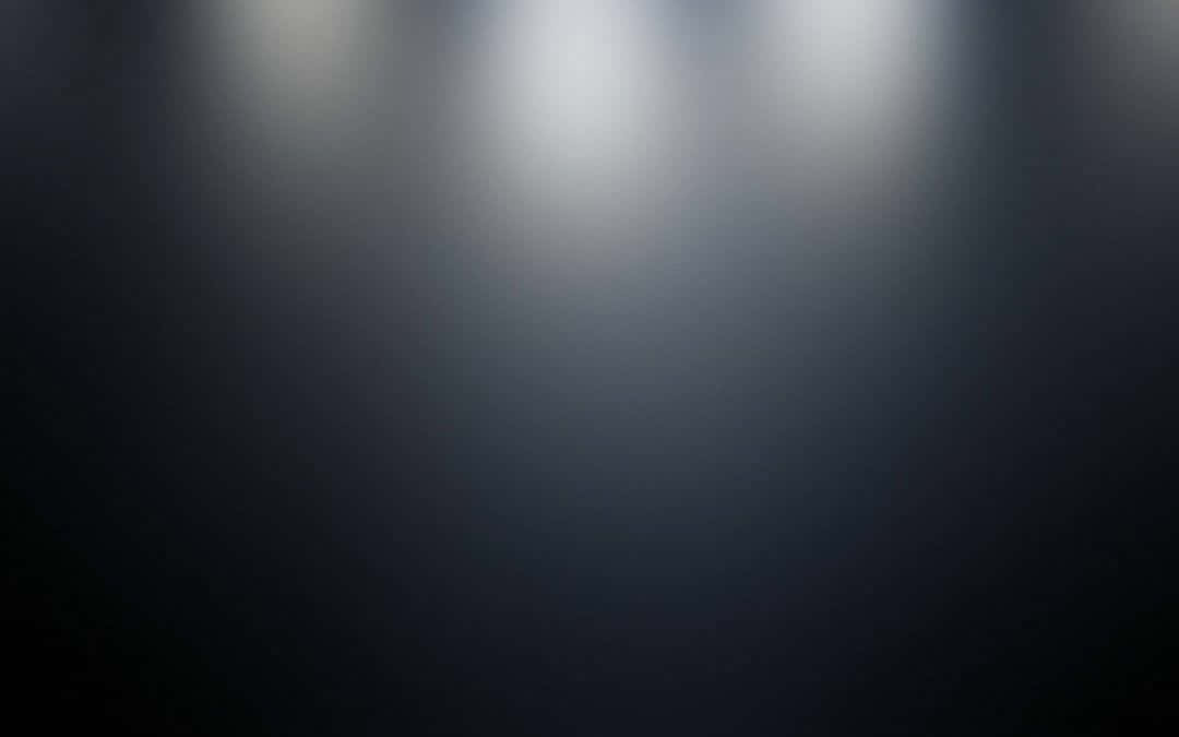 A Background Blending Deep Black To Light Grey Background