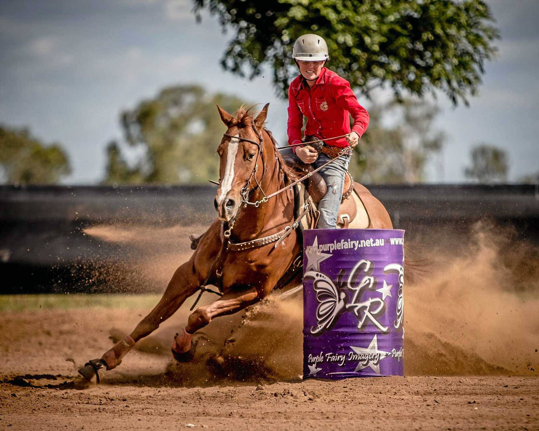 A Barrel Racer Displays Great Skill And Determination During A Competition. Background