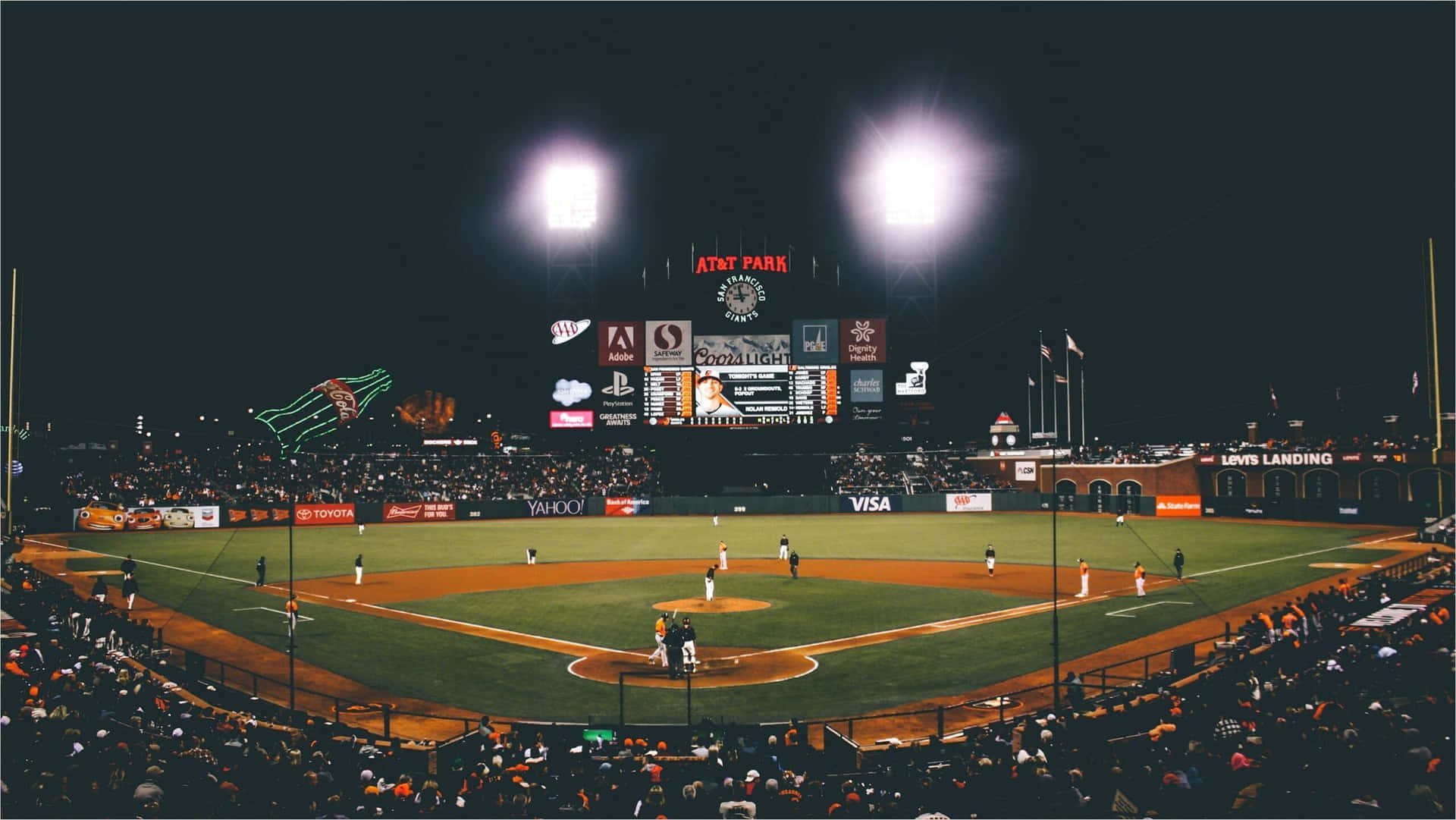 A Baseball Field With Lights Background