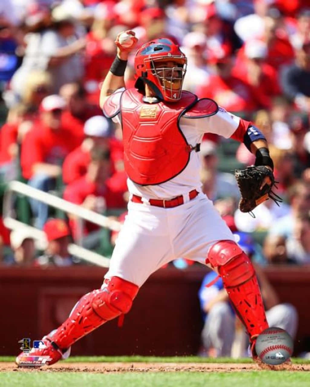 A Baseball Player In Red Gear Is Ready To Catch A Ball Background