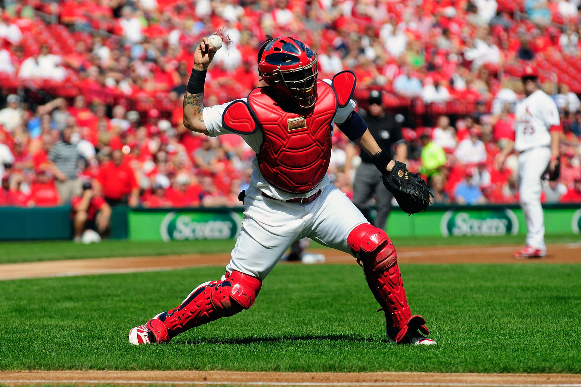 A Baseball Player Is Catching A Ball Background