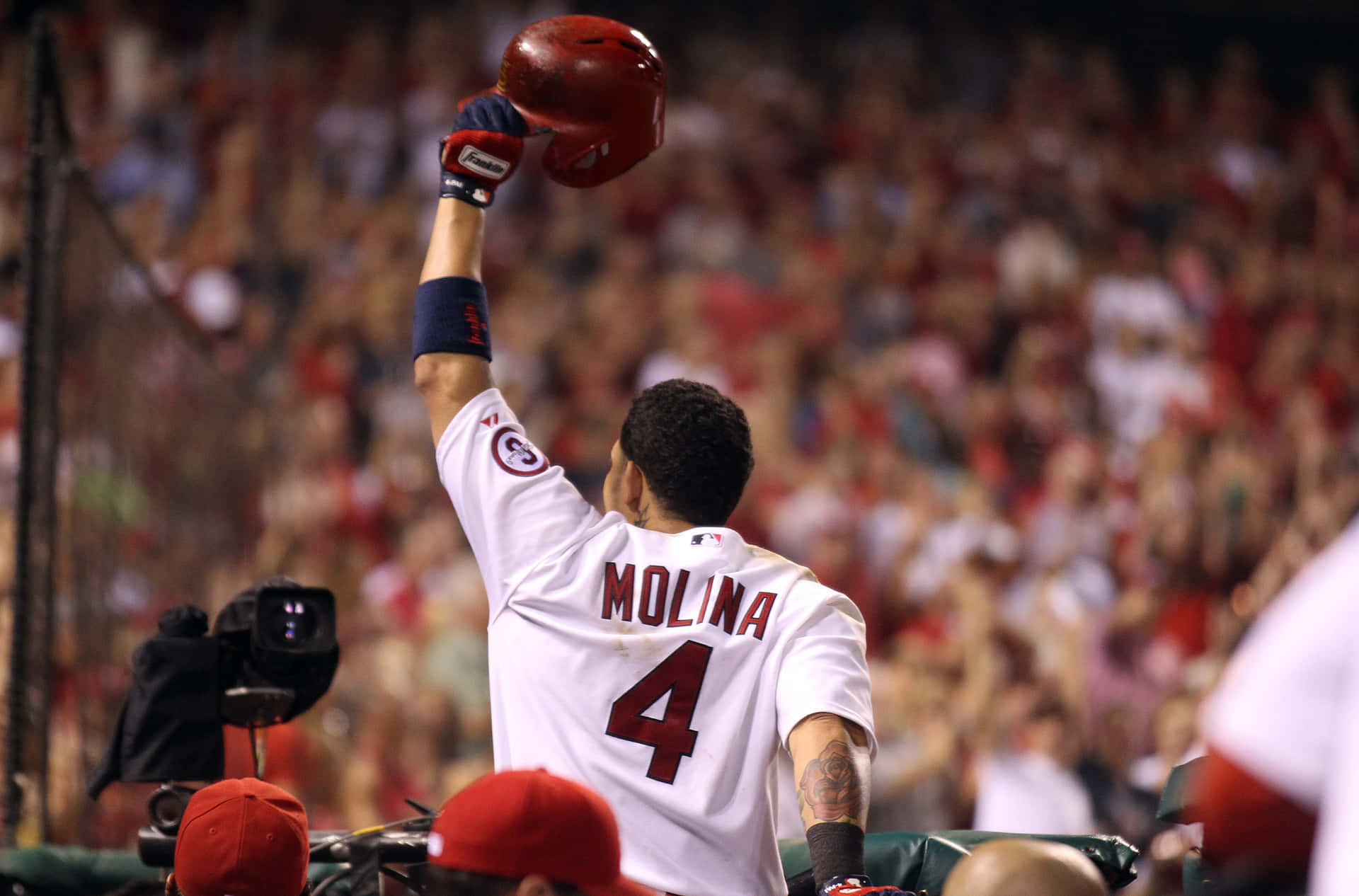 A Baseball Player Is Raising His Bat Background