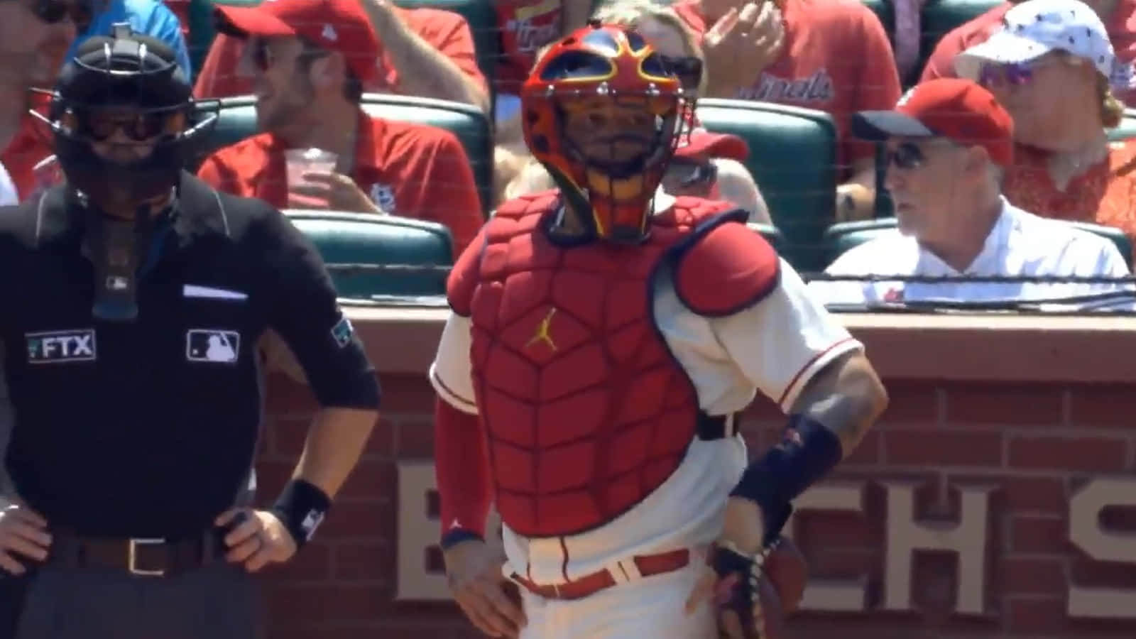 A Baseball Player Is Standing In Front Of A Catcher Background