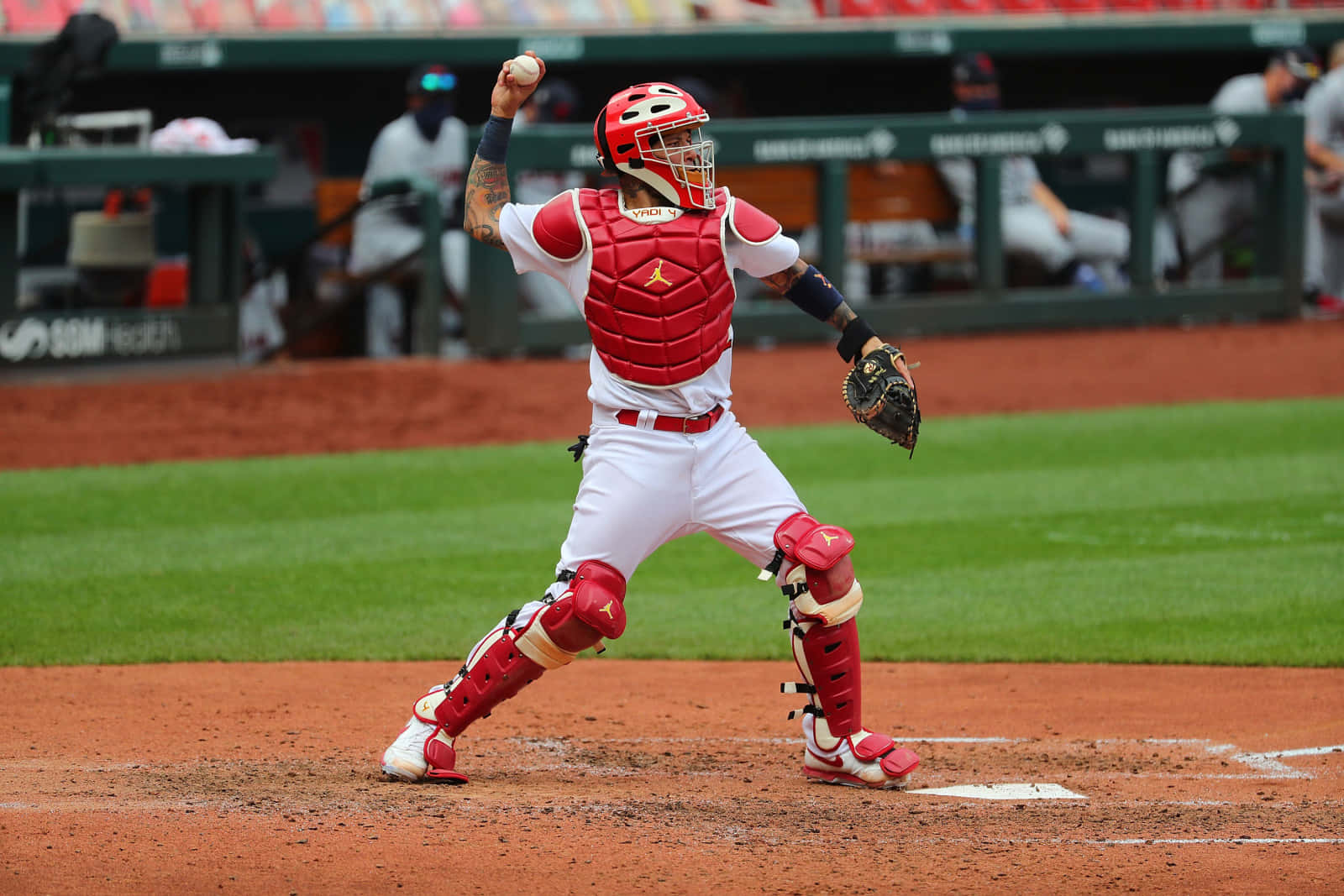 A Baseball Player Is Throwing A Ball Background
