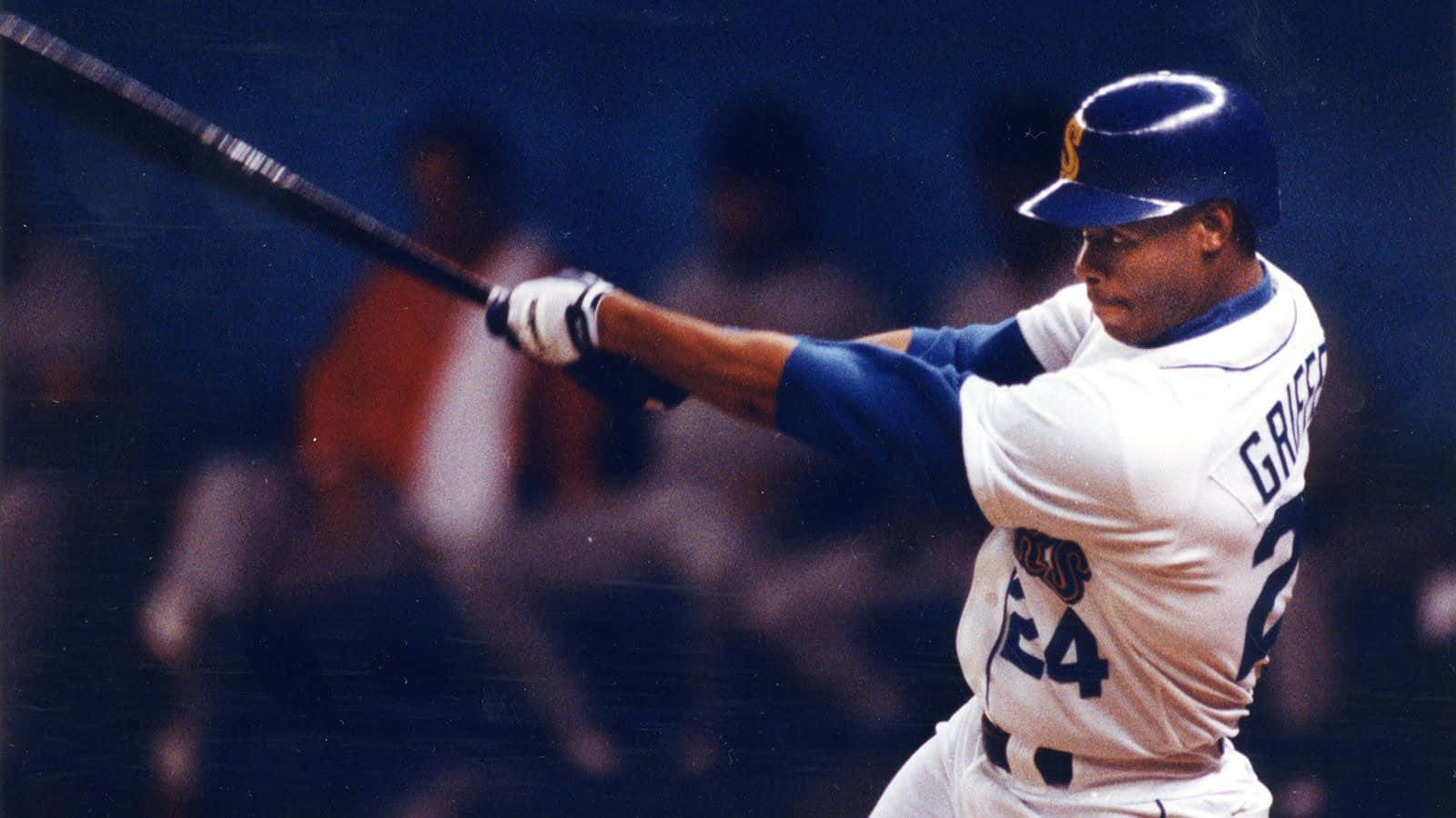 A Baseball Player Swinging A Bat