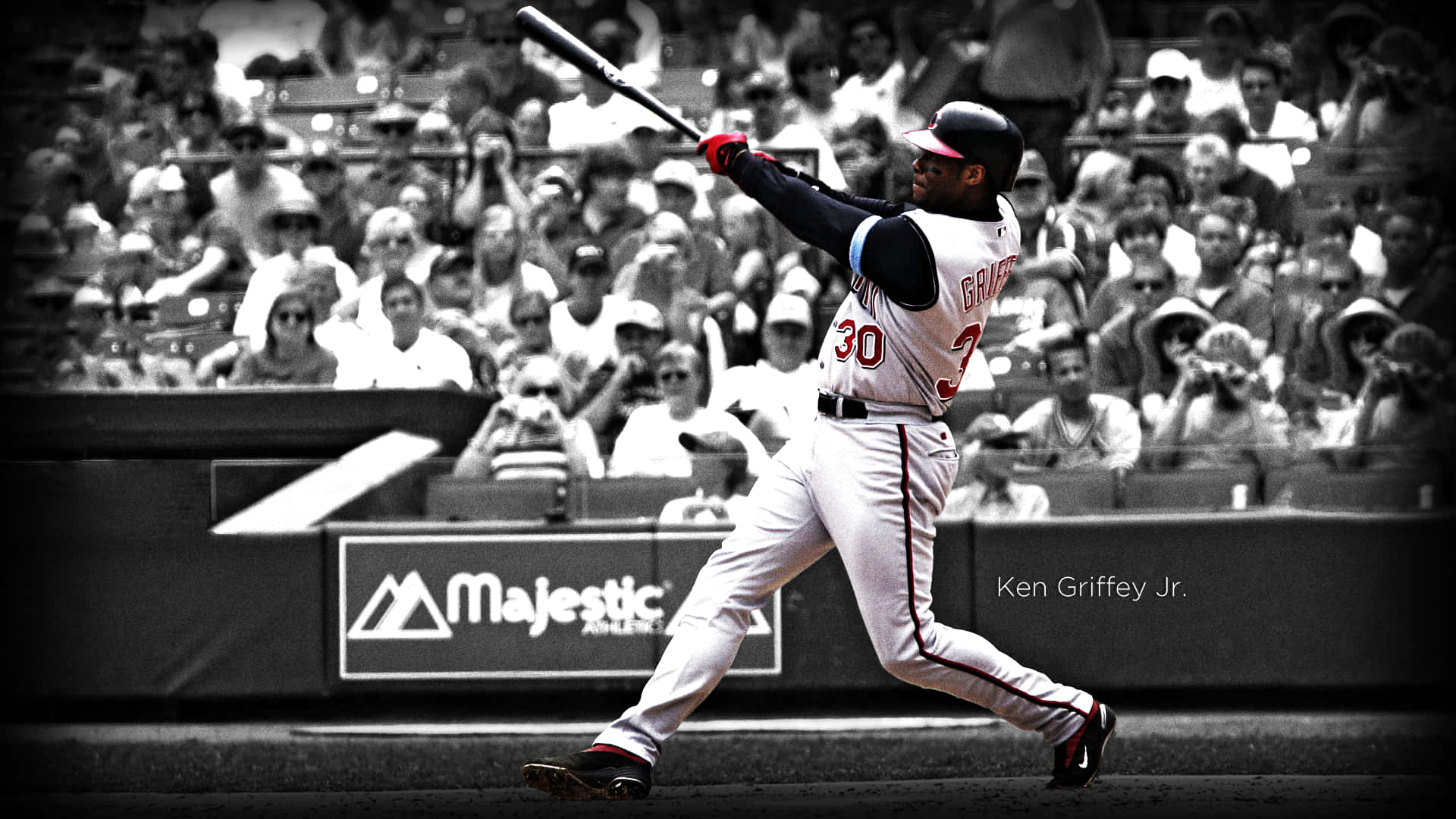 A Baseball Player Swinging A Bat