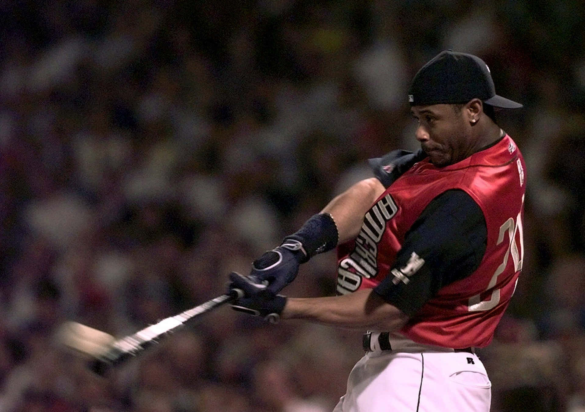 A Baseball Player Swinging A Bat Background