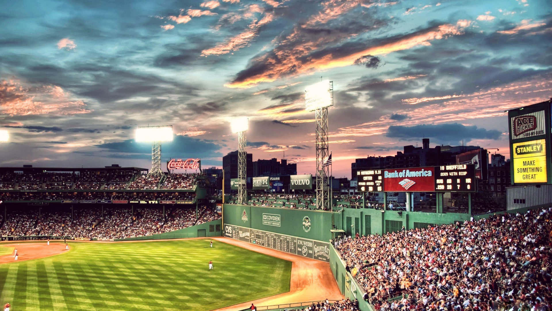 A Baseball Stadium With A Beautiful Sunset Background