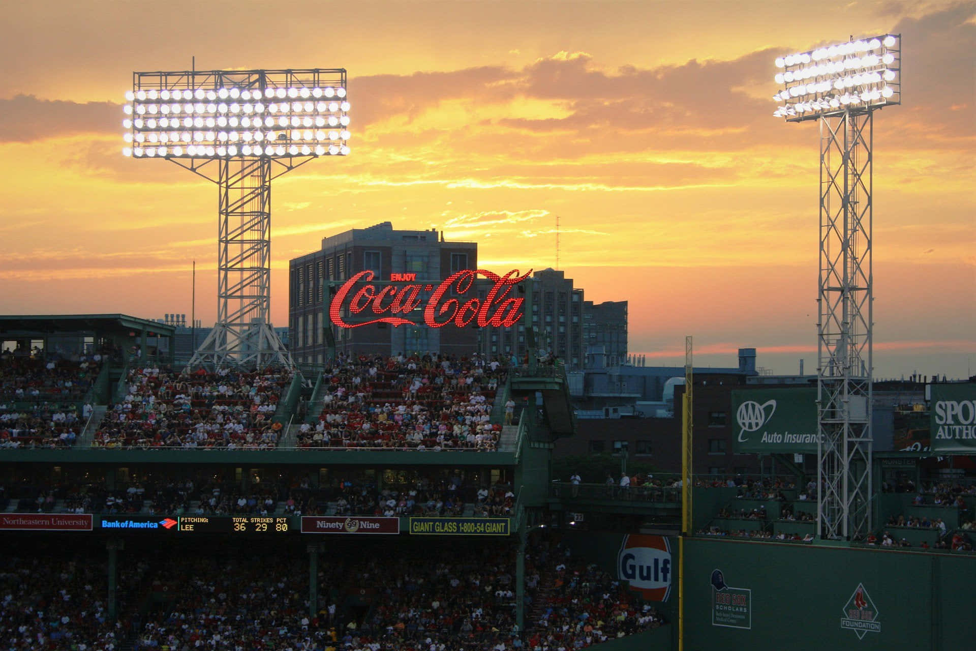 A Baseball Stadium With A Large Crowd Background