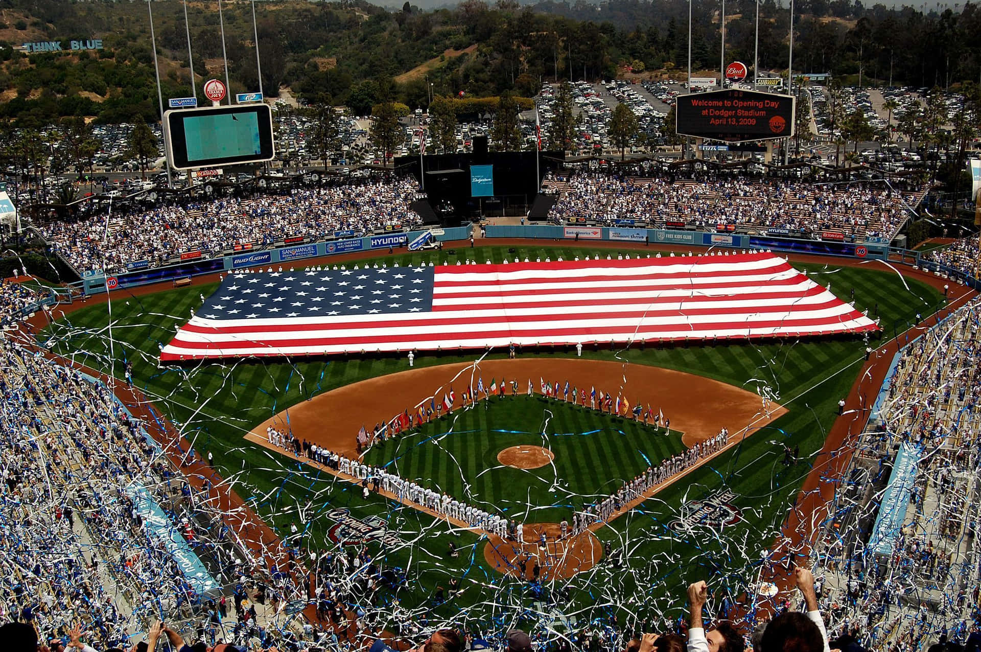 A Baseball Stadium With An American Flag Background