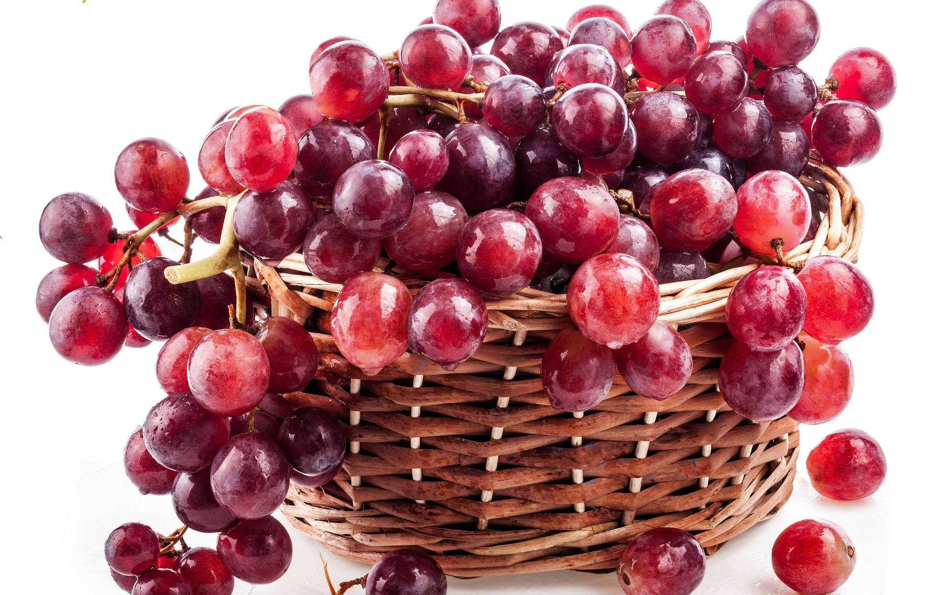 A Basket Full Of Luscious Red Grapes. Background