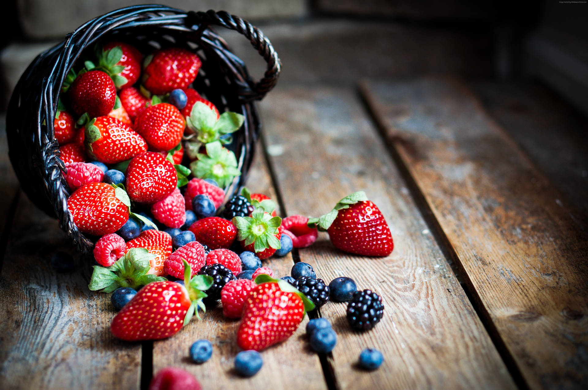 A Basket Of Mixed Raspberries Background