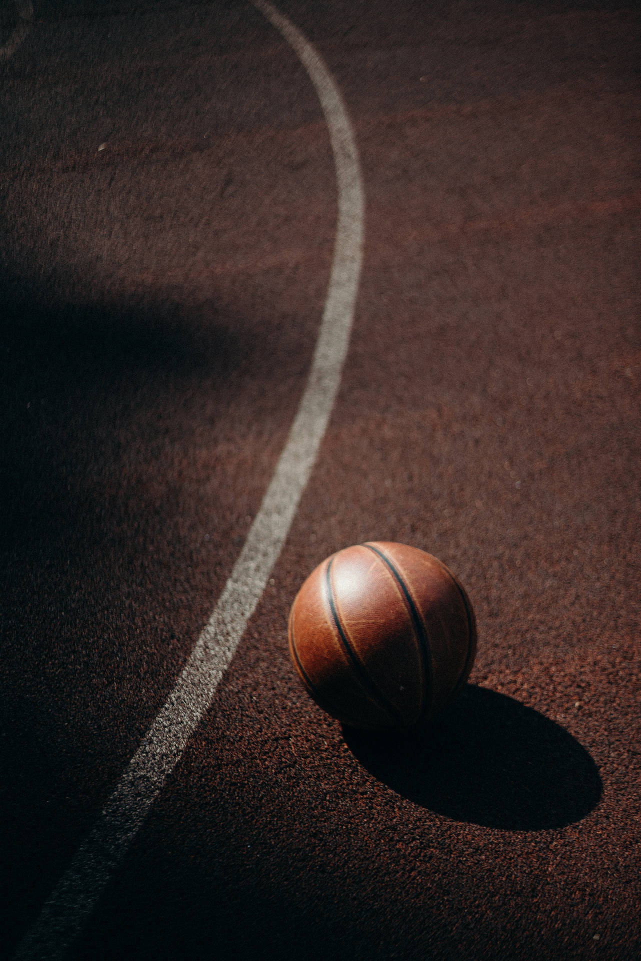 A Basketball Ball On A Court