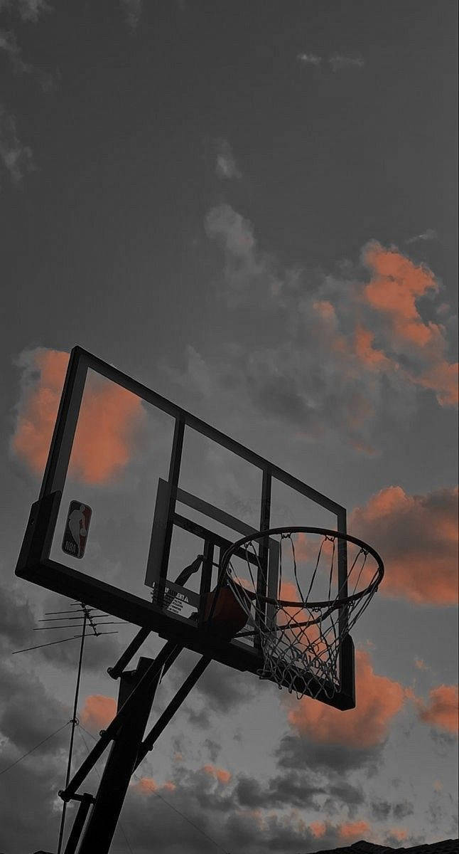 A Basketball Hoop In The Sky Background