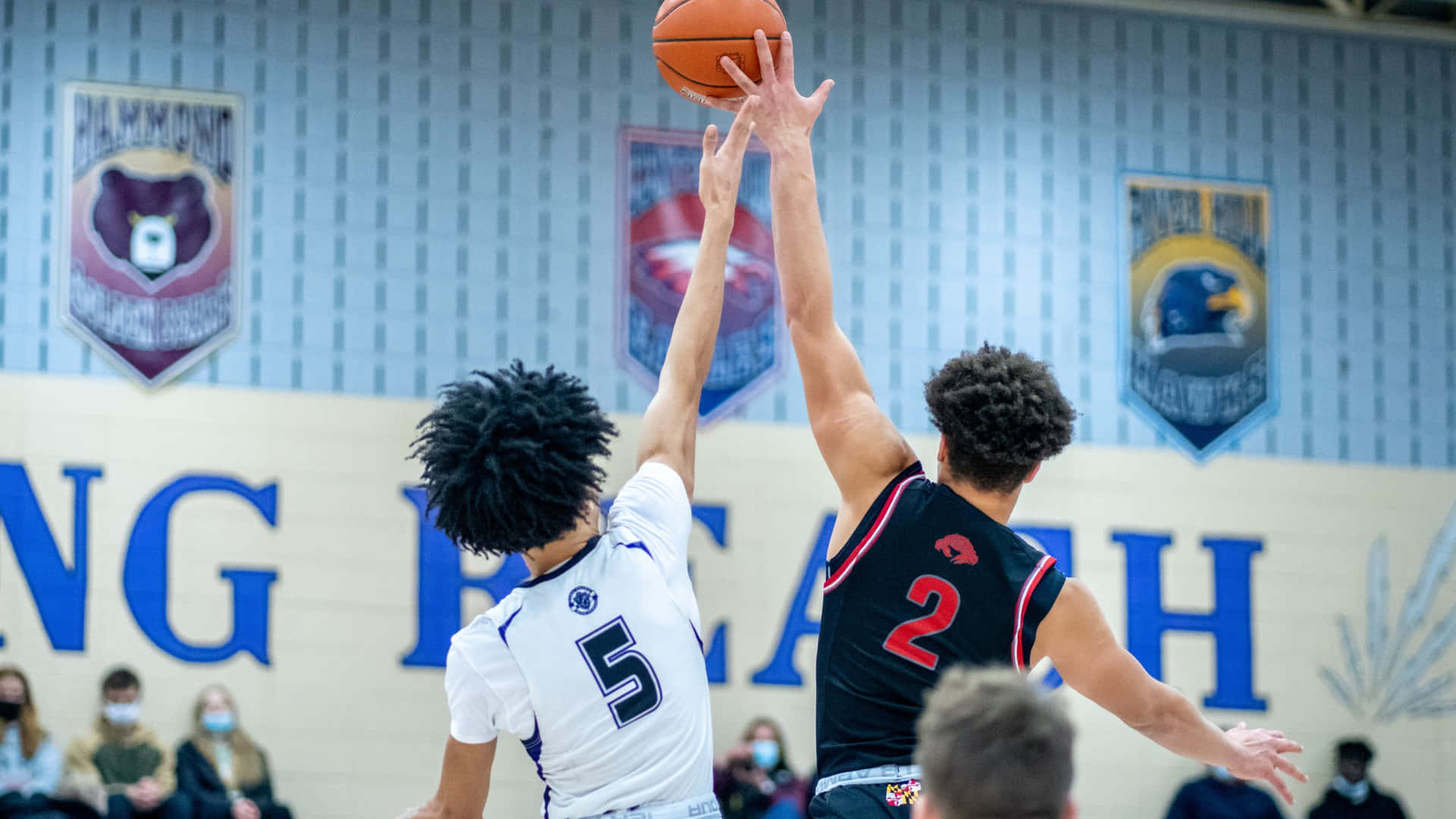 “a Basketball Player Dunking On The Court” Background