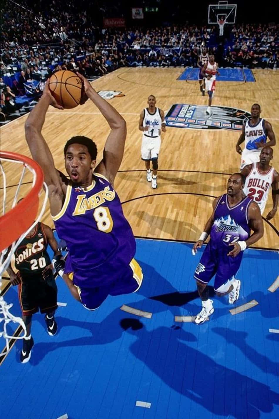 A Basketball Player Is Dunking On A Basketball Court Background