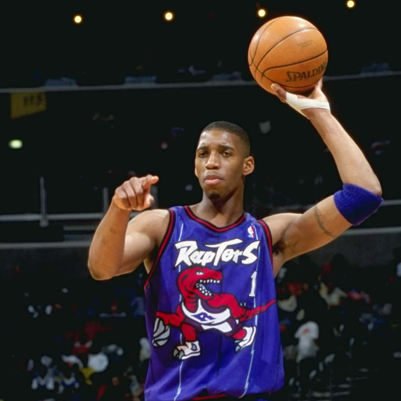 A Basketball Player Is Holding A Ball In His Hand Background