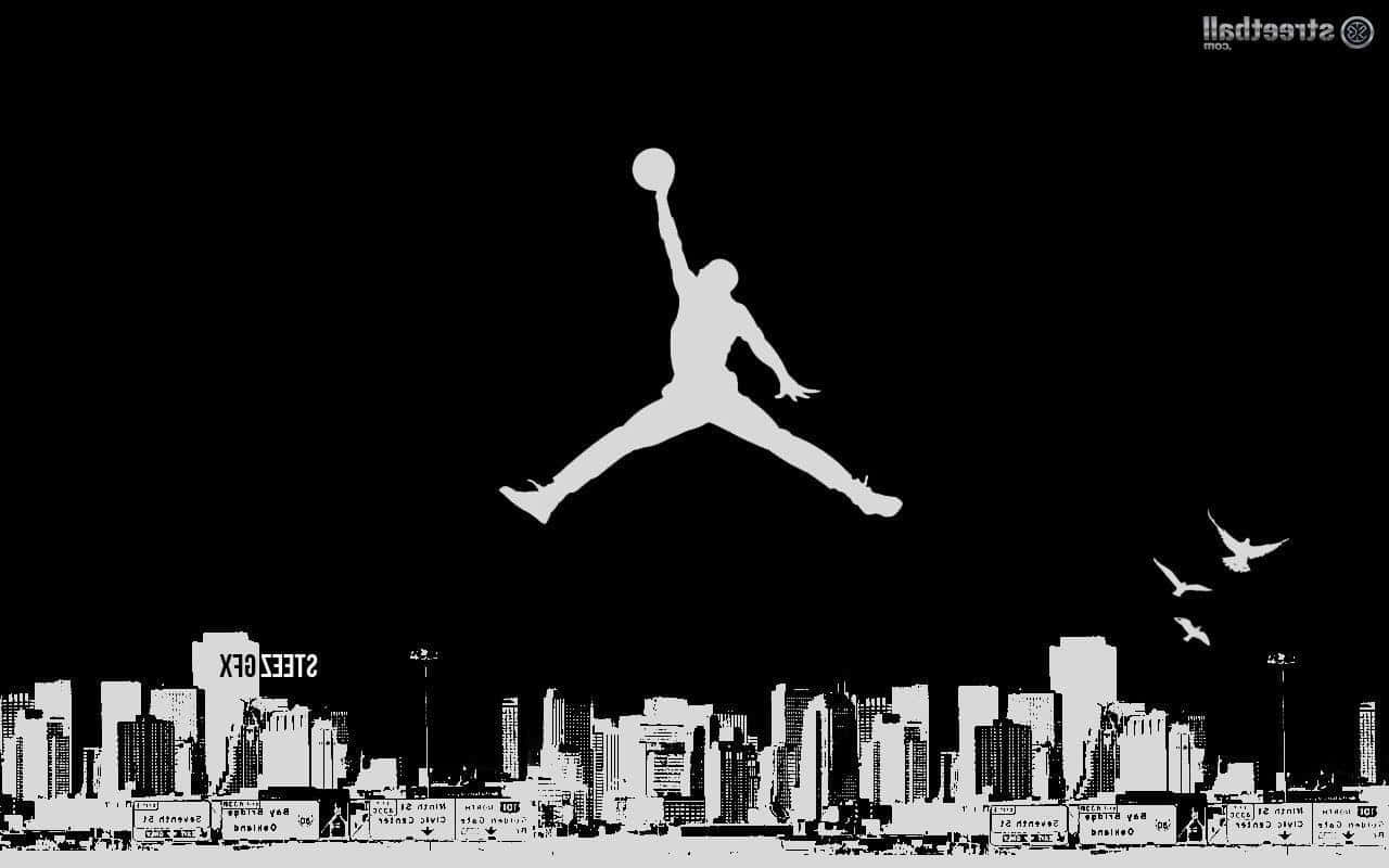 A Basketball Player Is Jumping In The Air Over A City