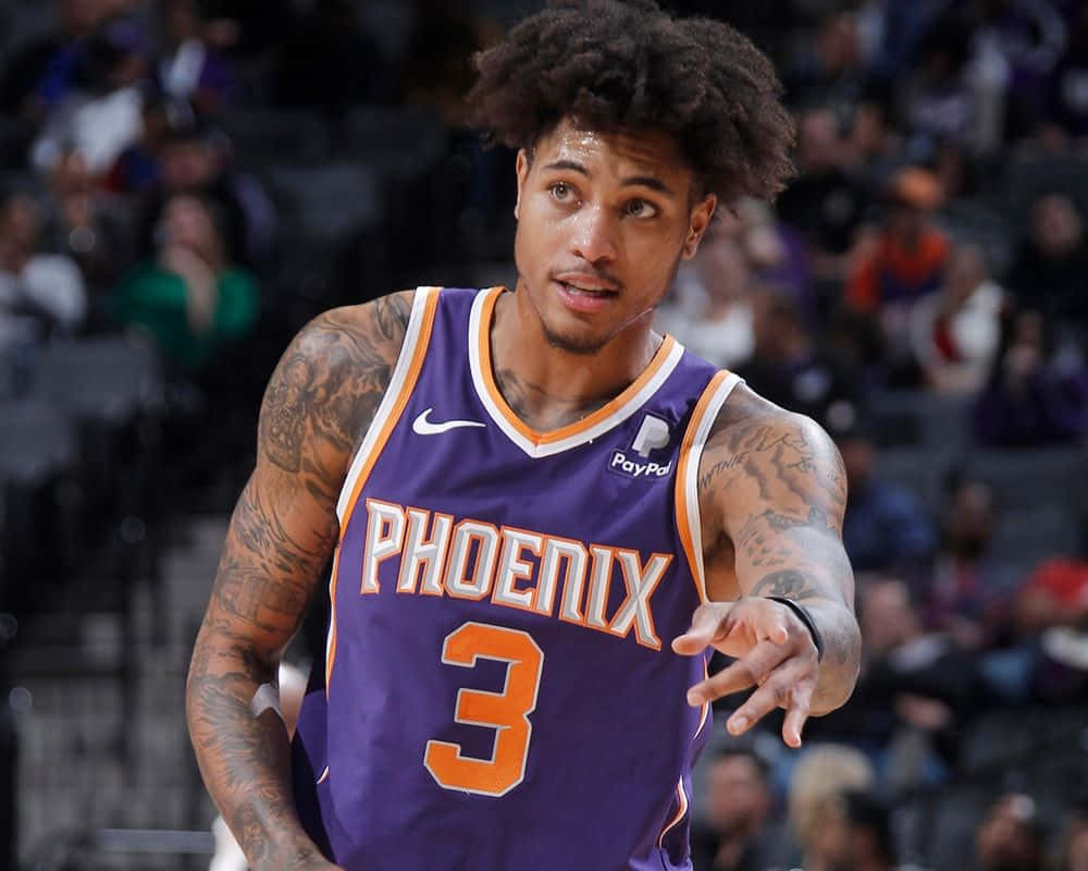A Basketball Player With Dreadlocks Is Holding A Ball Background