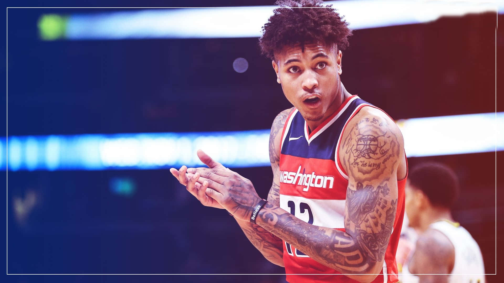 A Basketball Player With Tattoos And A Tattoo On His Arm Background