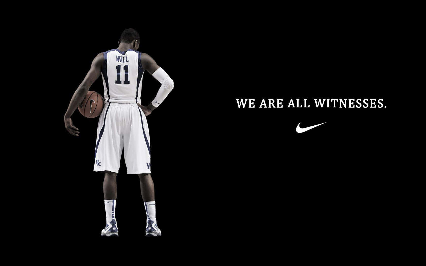 A Basketball Player With The Words We Are All Witnesses Background