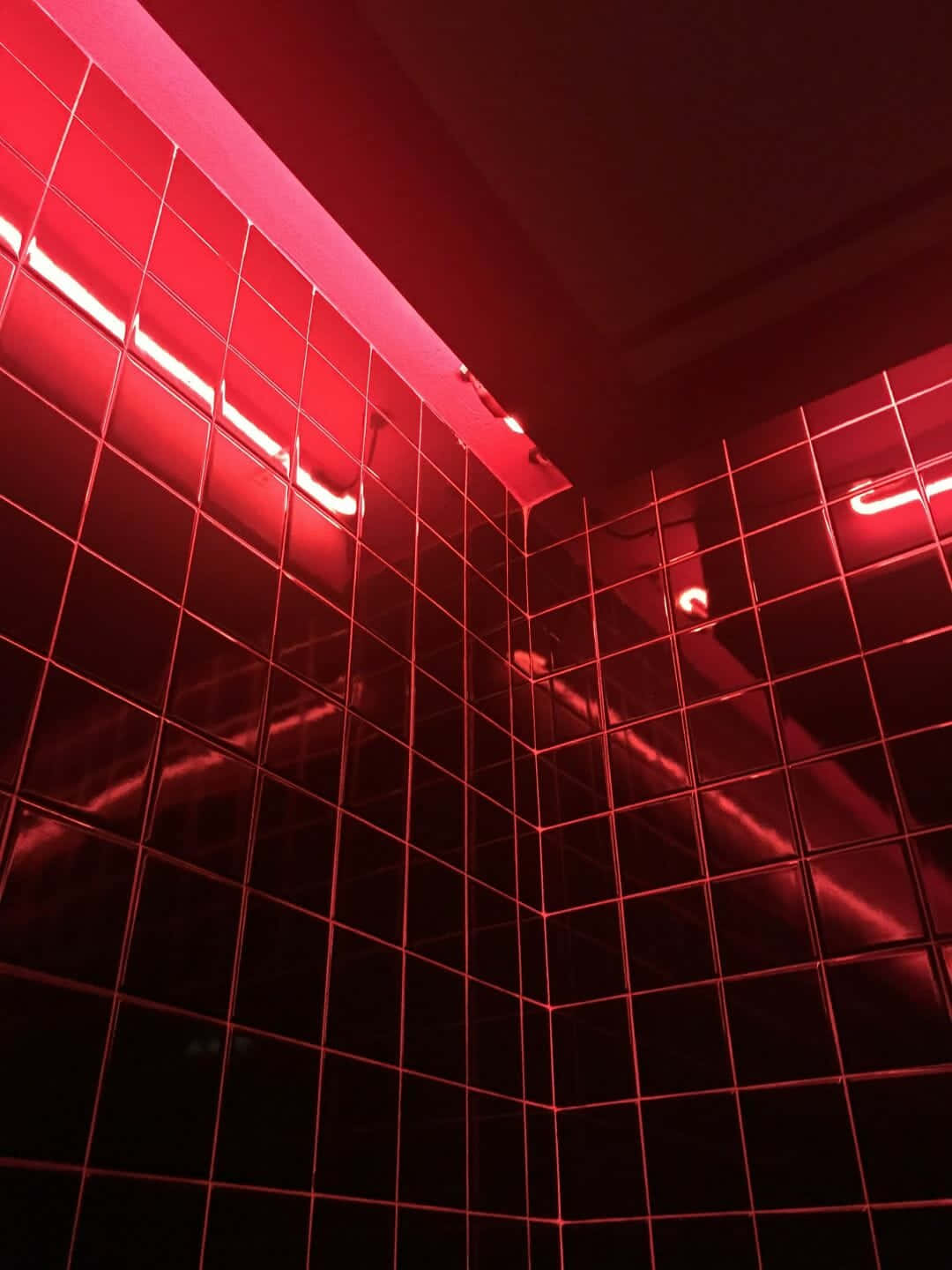 A Bathroom With Red Lights In The Wall Background