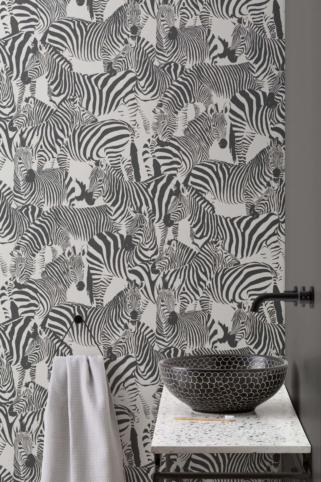 A Bathroom With Zebra Wallpaper And A Sink Background