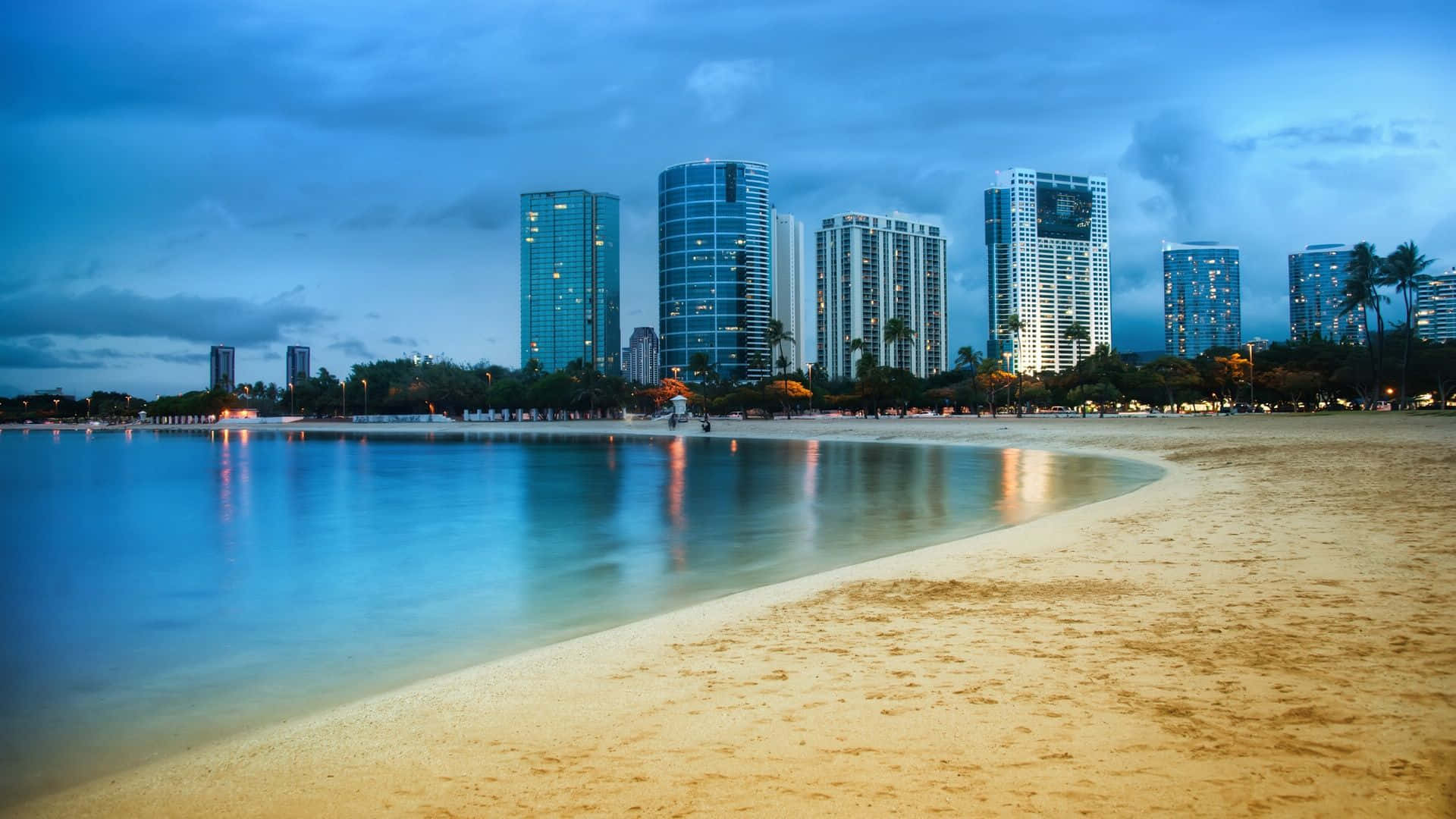 A Beach With Buildings And A Beach In The Distance