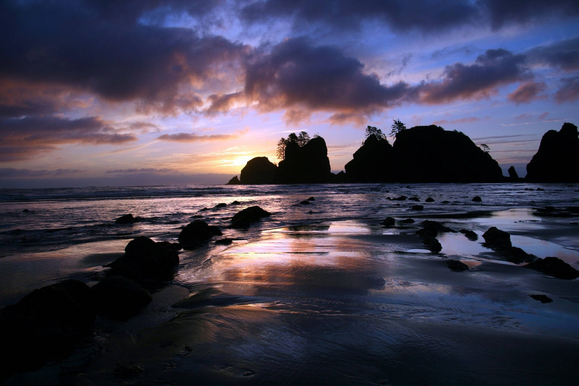 A Beach With Rocks Background