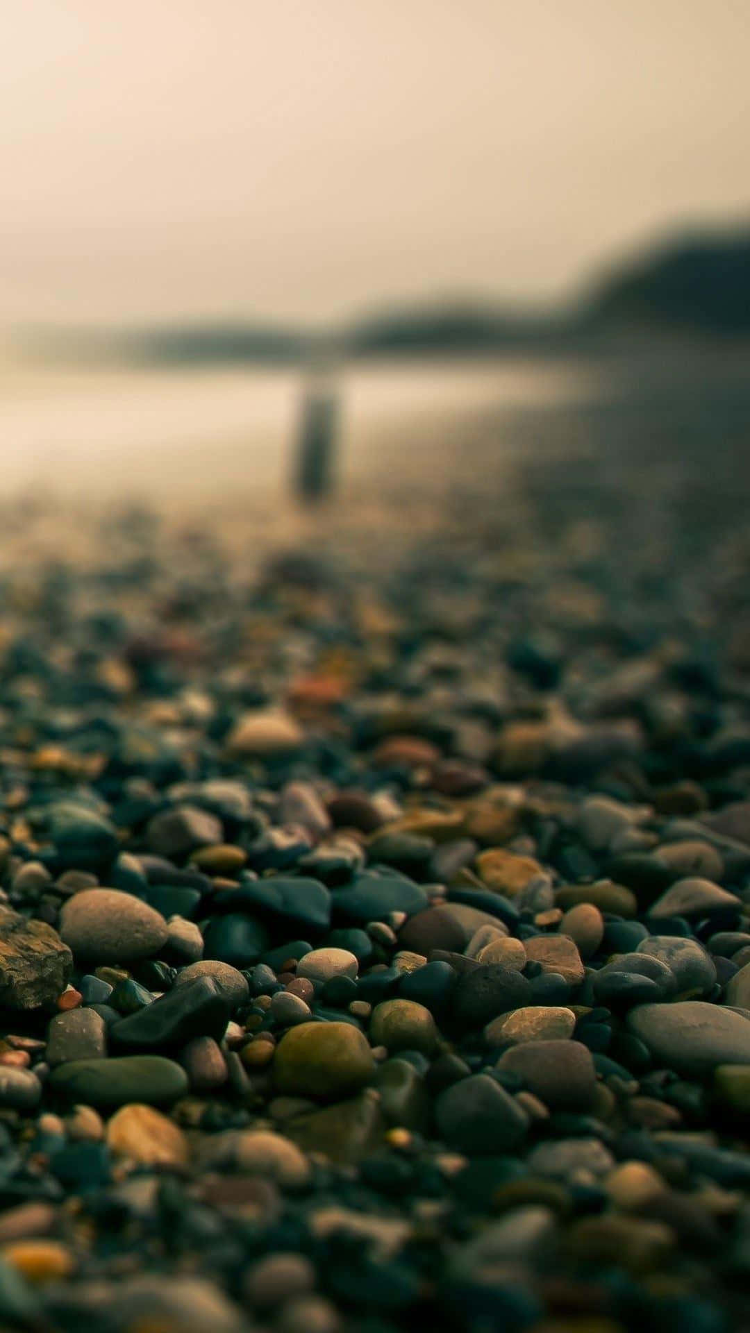 A Beach With Rocks And Pebbles On It