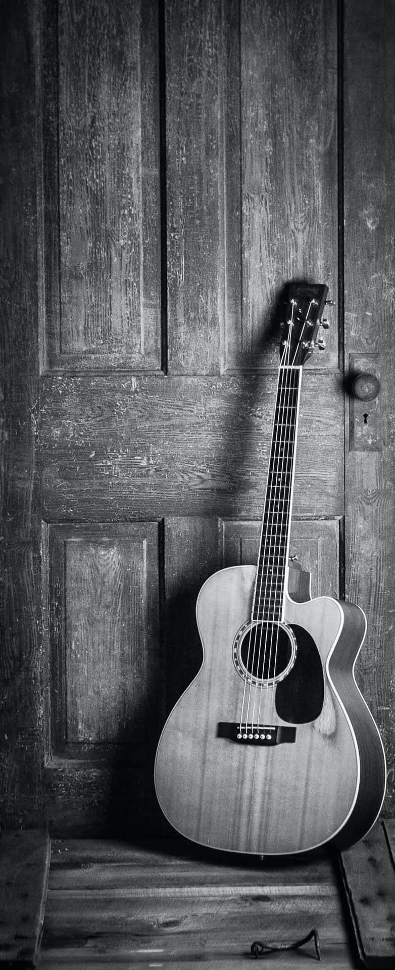 A Beautiful Acoustic Guitar, Perfect For Getting Creative! Background