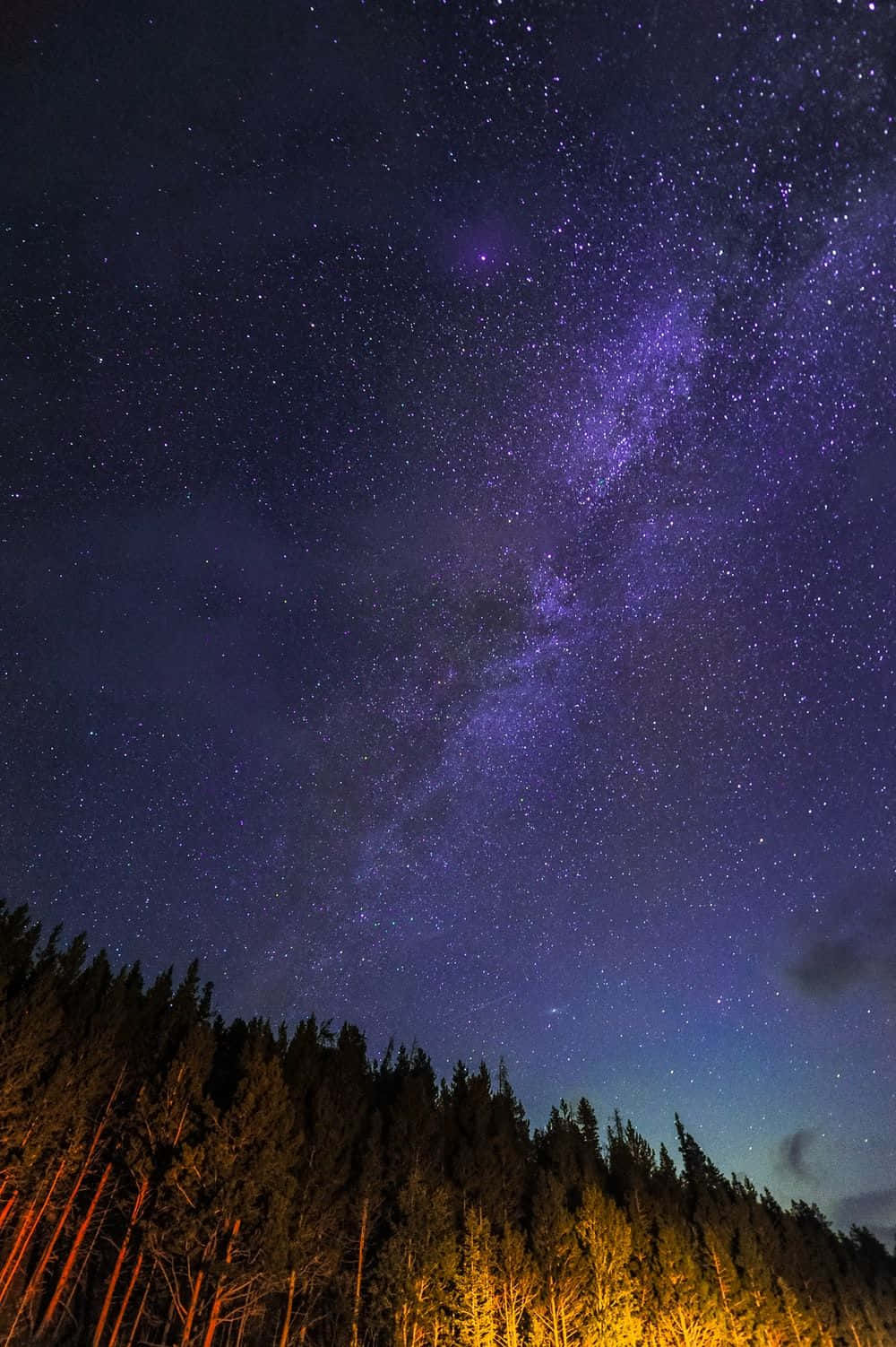A Beautiful Aesthetic Of Stars Spilling Across The Night Sky Background