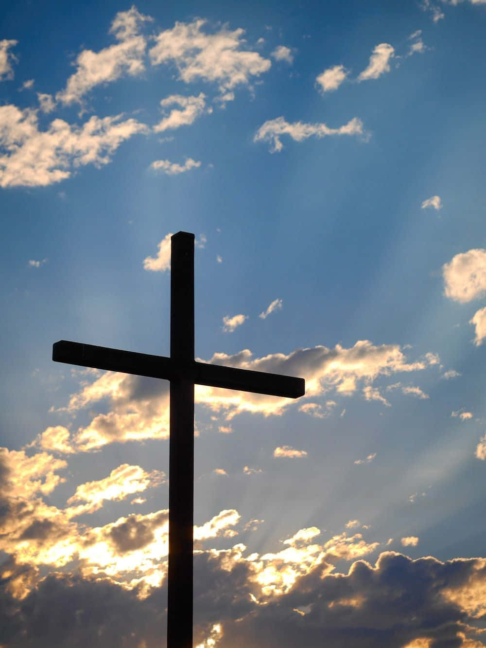 A Beautiful Cross On A Cloudy Sky Background