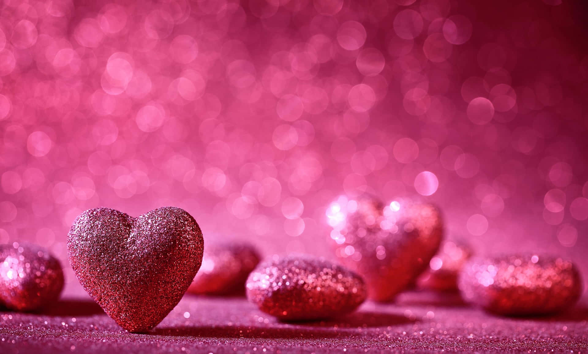 A Beautiful Display Of Glittery Pink Hearts Background