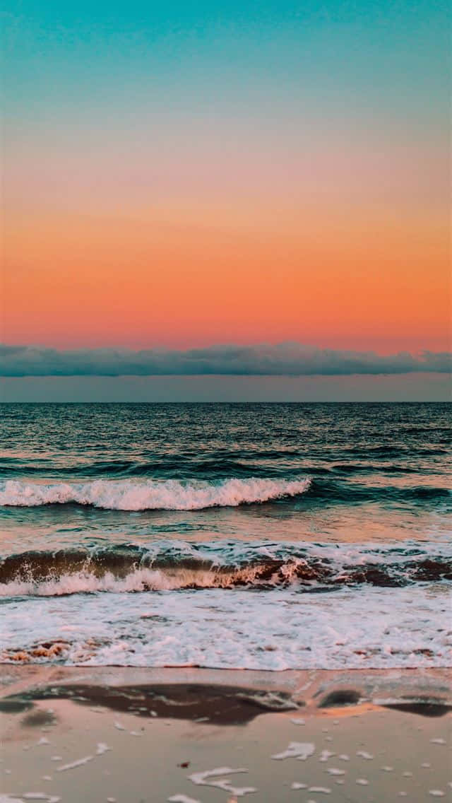 A Beautiful Sand Beach With An Iphone Taking In The View Background