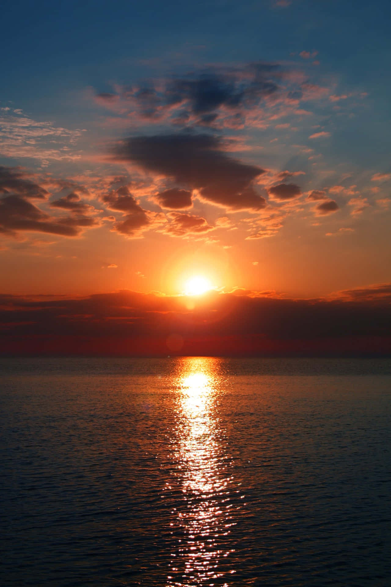 A Beautiful, Serene Sunset Over A Distant Horizon. Background